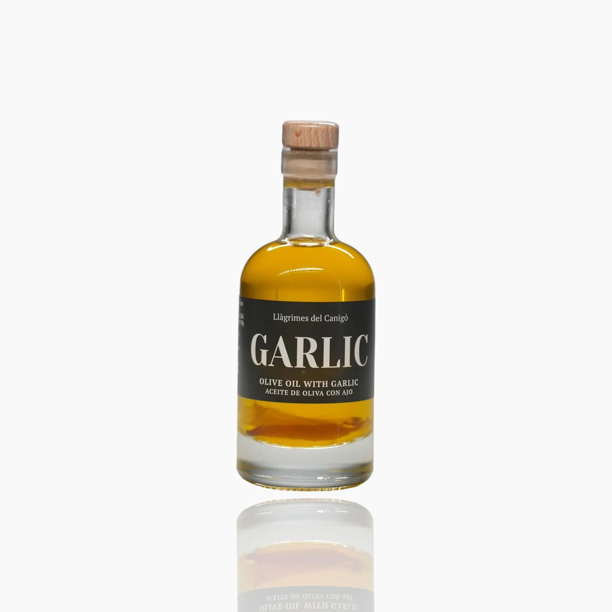 A 100ml bottle of premium garlic-infused olive oil with a wooden cork, labeled "Garlic" in bold font.