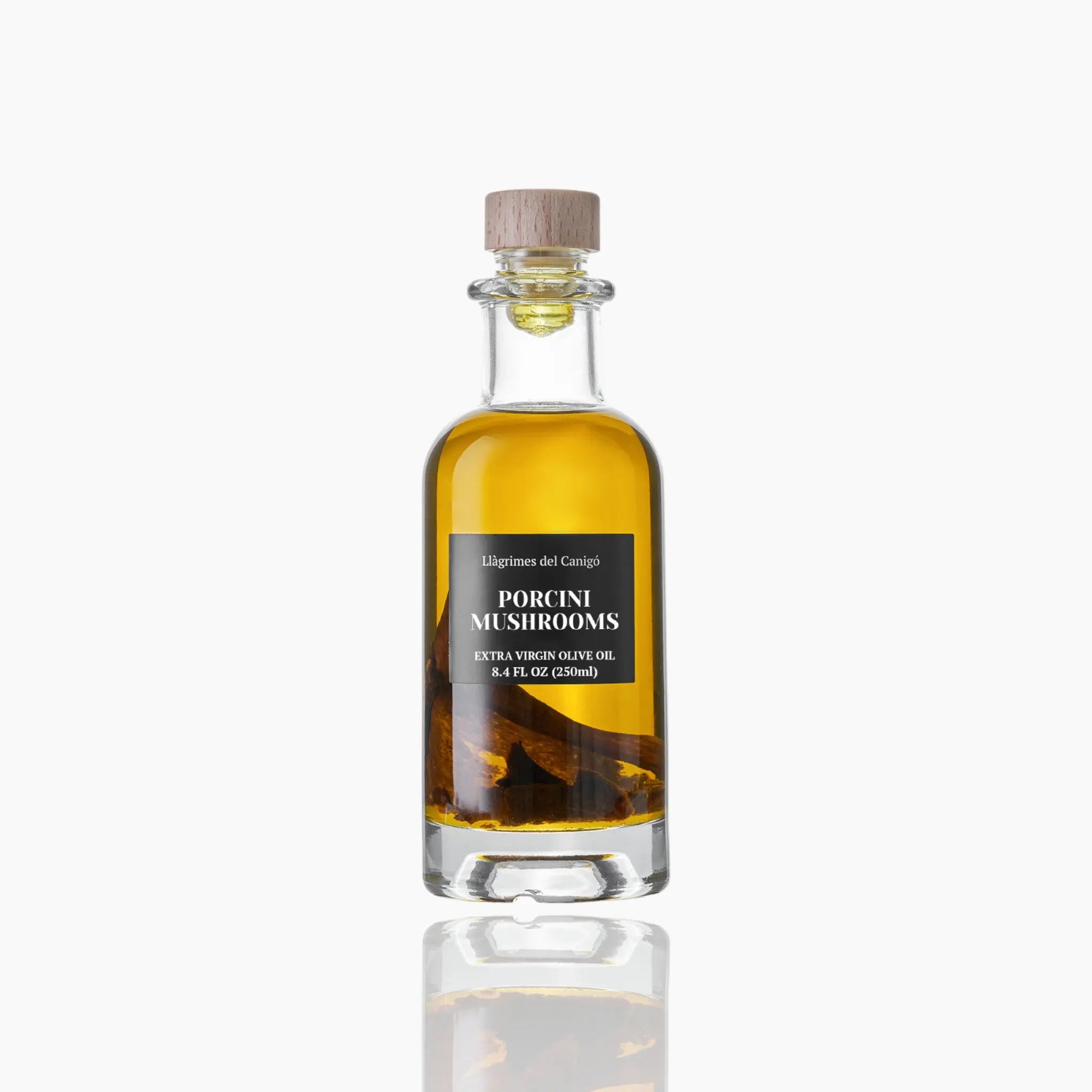 A 250ml bottle of porcini mushroom-infused extra virgin olive oil with porcini slices inside and a cork stopper.