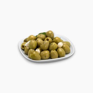 García Golden Pitted Olives served on a gourmet salad